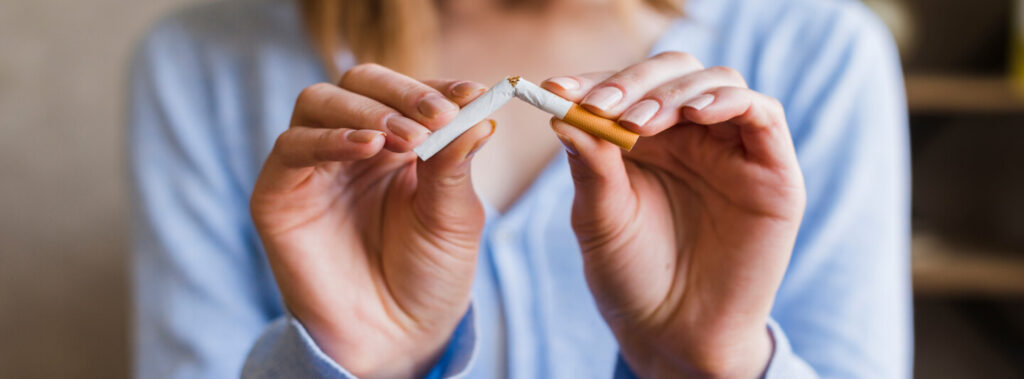 woman breaking a cigarette
