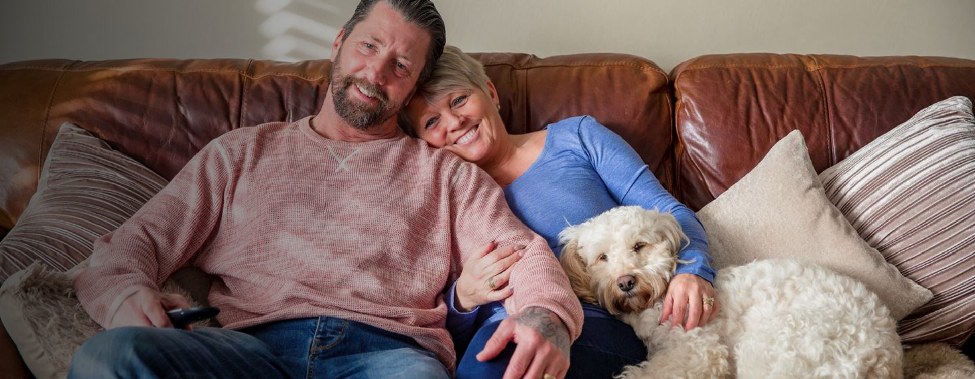Man and elderly woman smiling