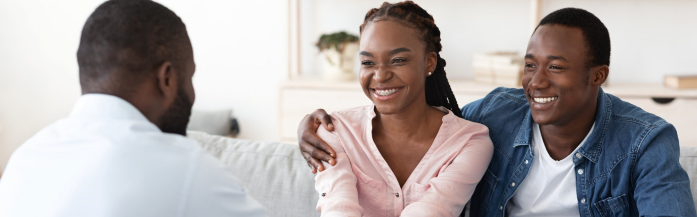 couple smiling at the man