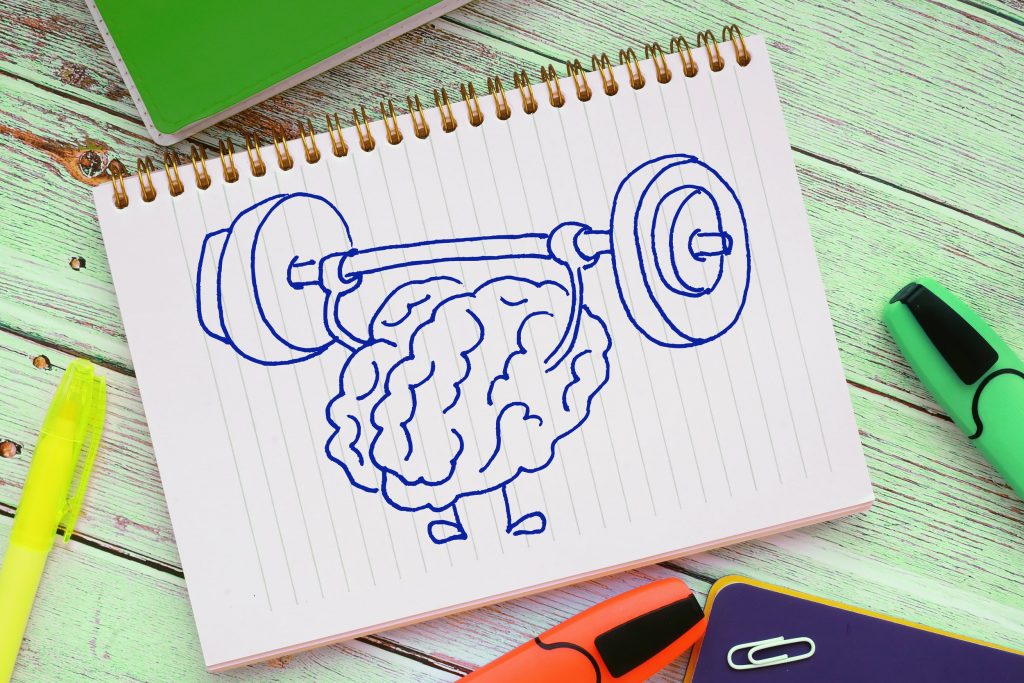 Brain training rock the muscles with a barbell. Creative idea concept.