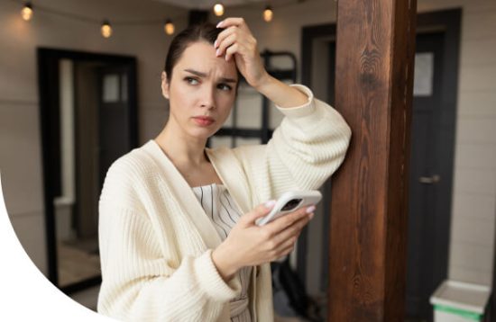 young-woman-received-sad-message-phone-looks-puzzled-into-distance-1